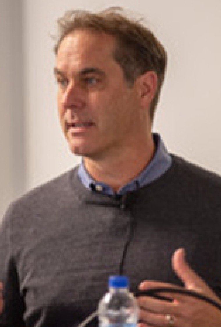 Andrew Dillin speaking at a conference
